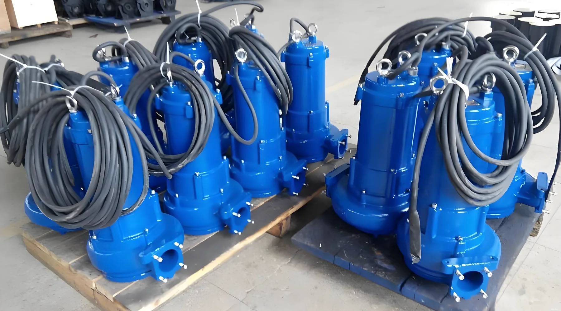 Supplied reference image showing multiple blue submersible pumps